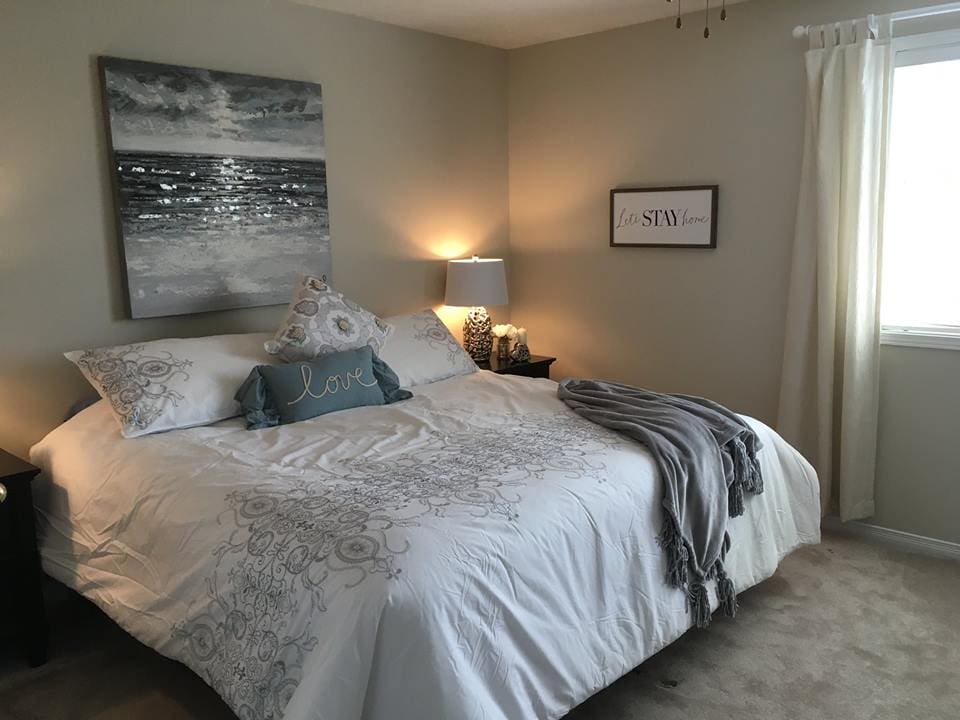 Picture of bedroom after | A staged living room rich in blues | MatiDesign Interior Decorating And Home Staging London Ontario