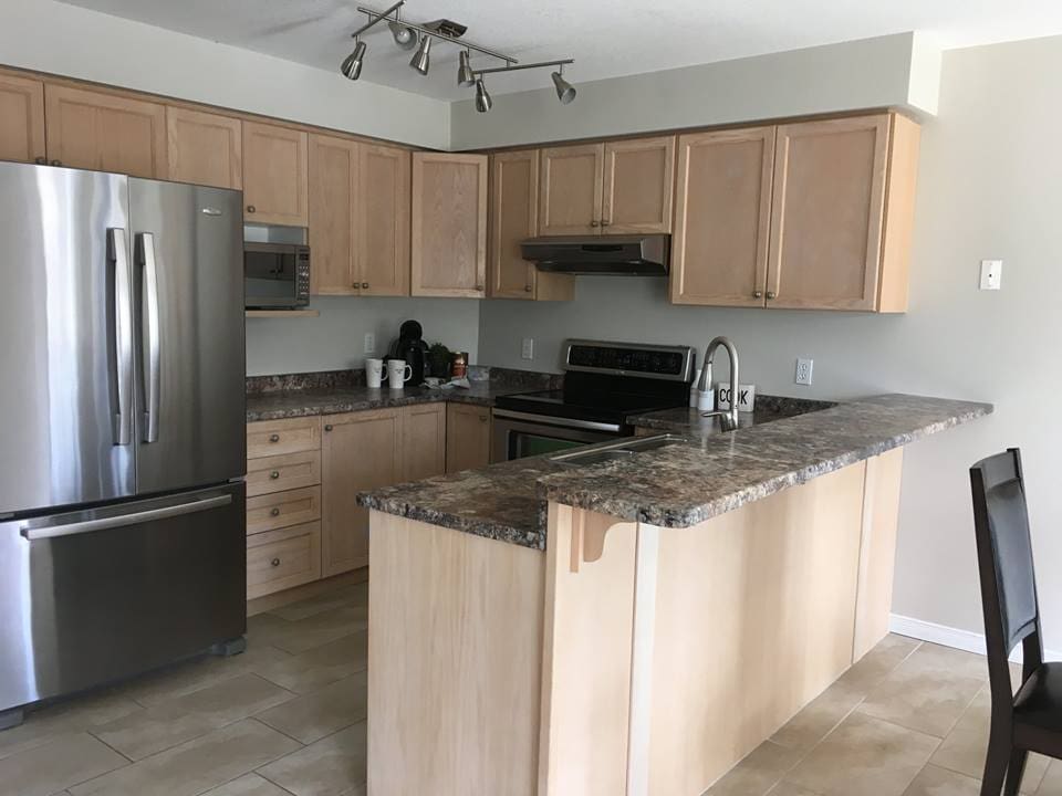 Picture of kitchen after | A staged living room rich in blues | MatiDesign Interior Decorating And Home Staging London Ontario