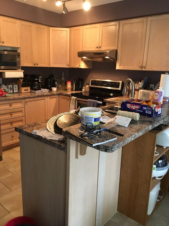Picture of kitchen before | A staged living room rich in blues | MatiDesign Interior Decorating And Home Staging London Ontario